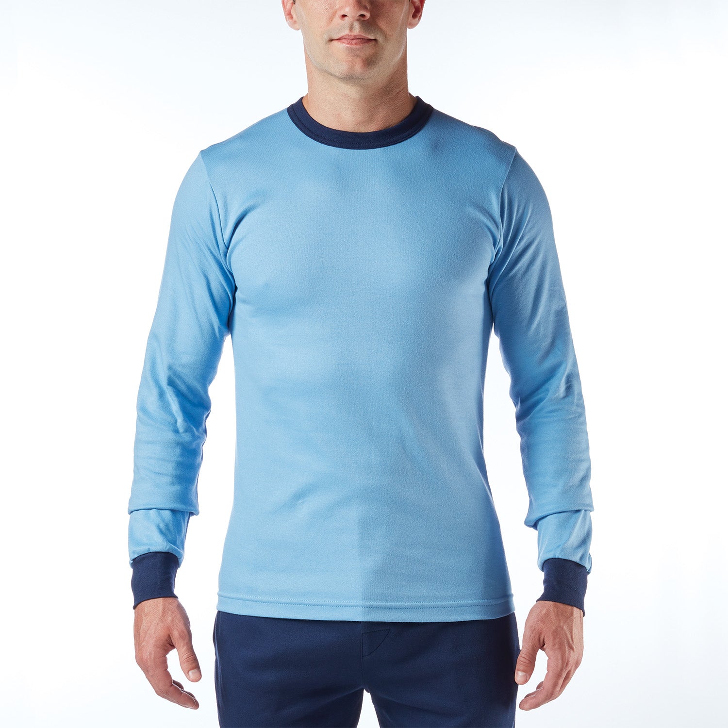 Man wearing a light blue long-sleeve shirt with dark blue collar and cuffs on a white background