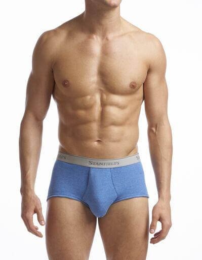 This image displays the "Men's Supreme Brief - 2 Pack", highlighting the comfort and design of the briefs. The man in the image is wearing a pair of white briefs, which demonstrates the product's sleek and modern style.