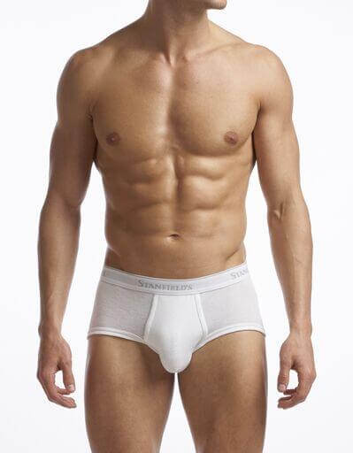 This image displays the "Men's Supreme Brief - 2 Pack", highlighting the comfort and design of the briefs. The man in the image is wearing a pair of white briefs, which demonstrates the product's sleek and modern style.